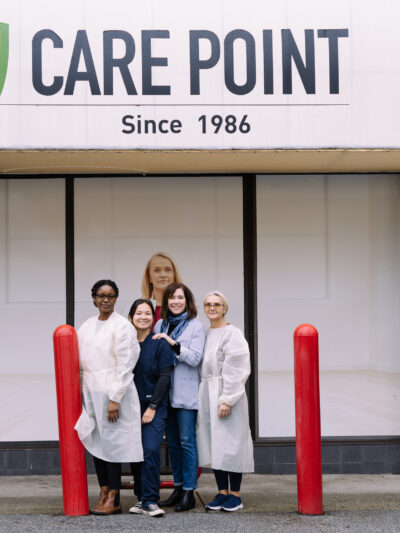 Clinic staff stand outside the Care Point Clinic on Davie Street in Vancouver's West End neighbourhood.